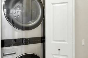 washer and dryer stacked in laundry closet during dryer vent cleaning service in Dundalk MD